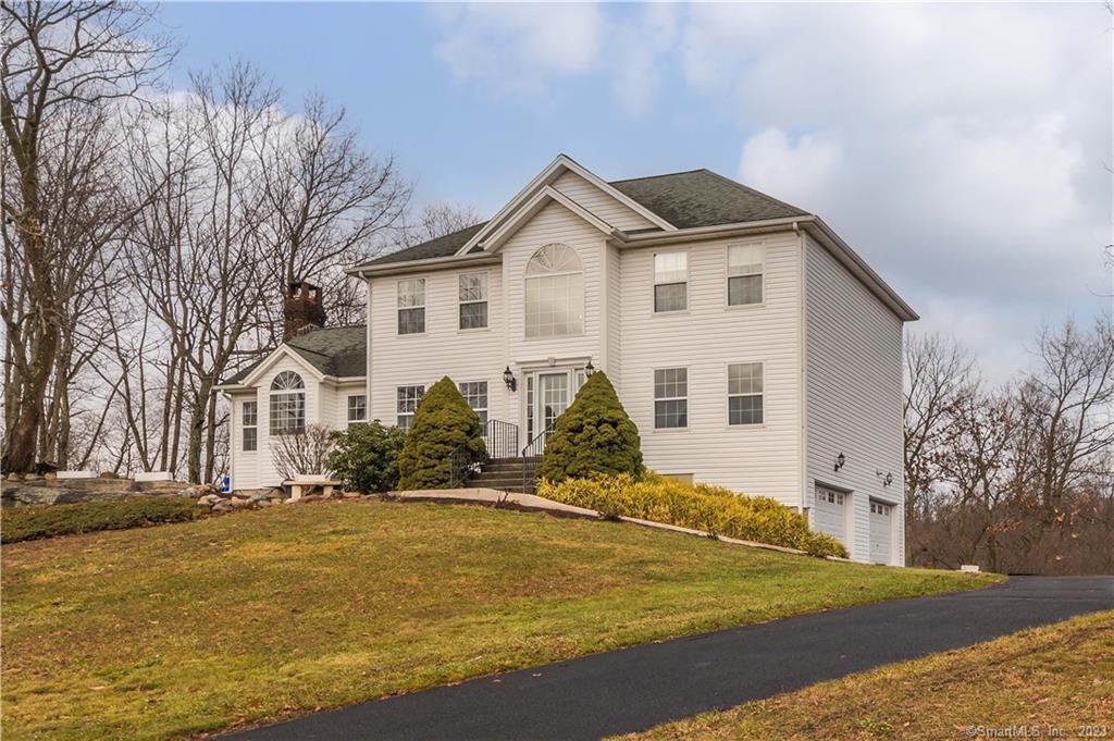 20 Westview Road Beacon Falls, CT 06403 - Photo 1 of 1 a view of a house with snow on the side of it