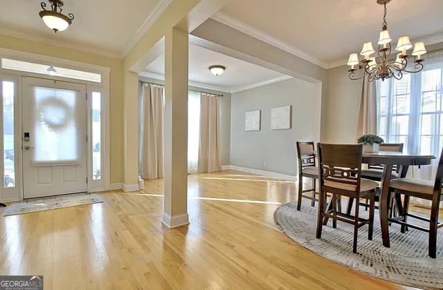 a view of a room with wooden floor and stairs