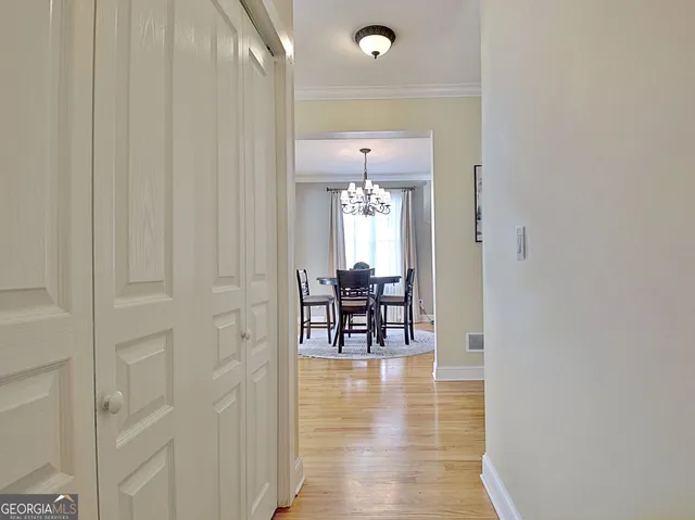 a kitchen with a dining table and chairs