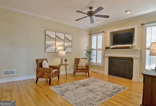 a kitchen with granite countertop a refrigerator and cabinets