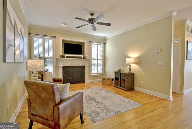 a kitchen with granite countertop a stove and a wooden floors