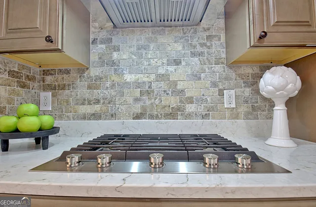 a view of a hallway with wooden floor and entryway