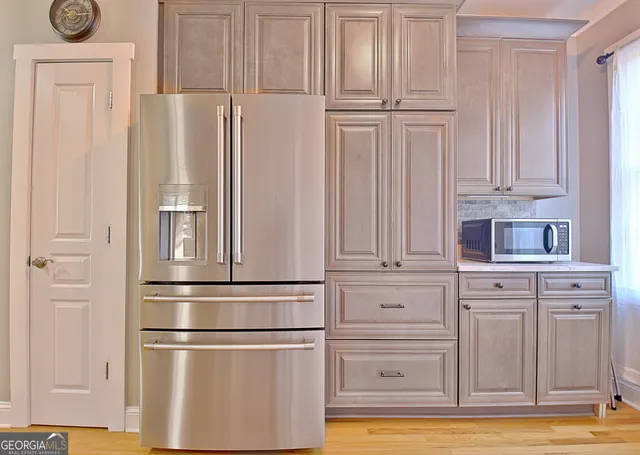 a bathroom with a tub a sink and mirror