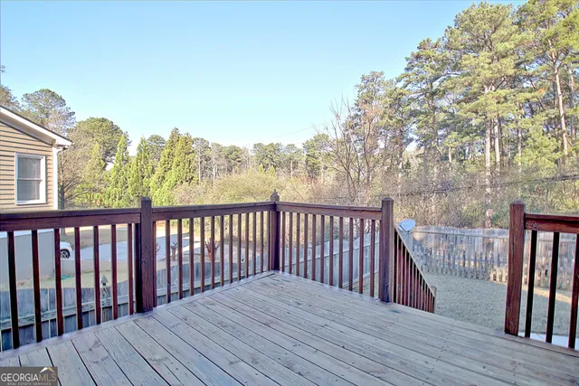 a bathroom with a sink a toilet and a shower