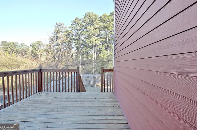 a living room with a couch and a potted plant