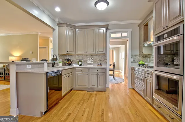 a street view with a house and trees in the background
