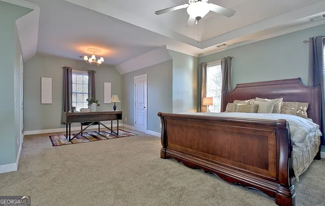 a view of a patio with table and chairs and wooden fence