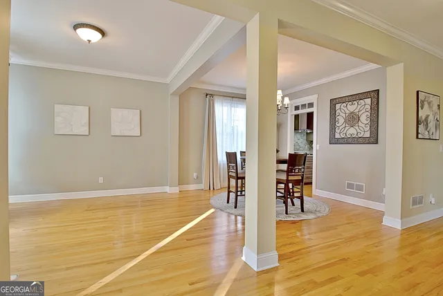 a view of a dining room with furniture and wooden floor