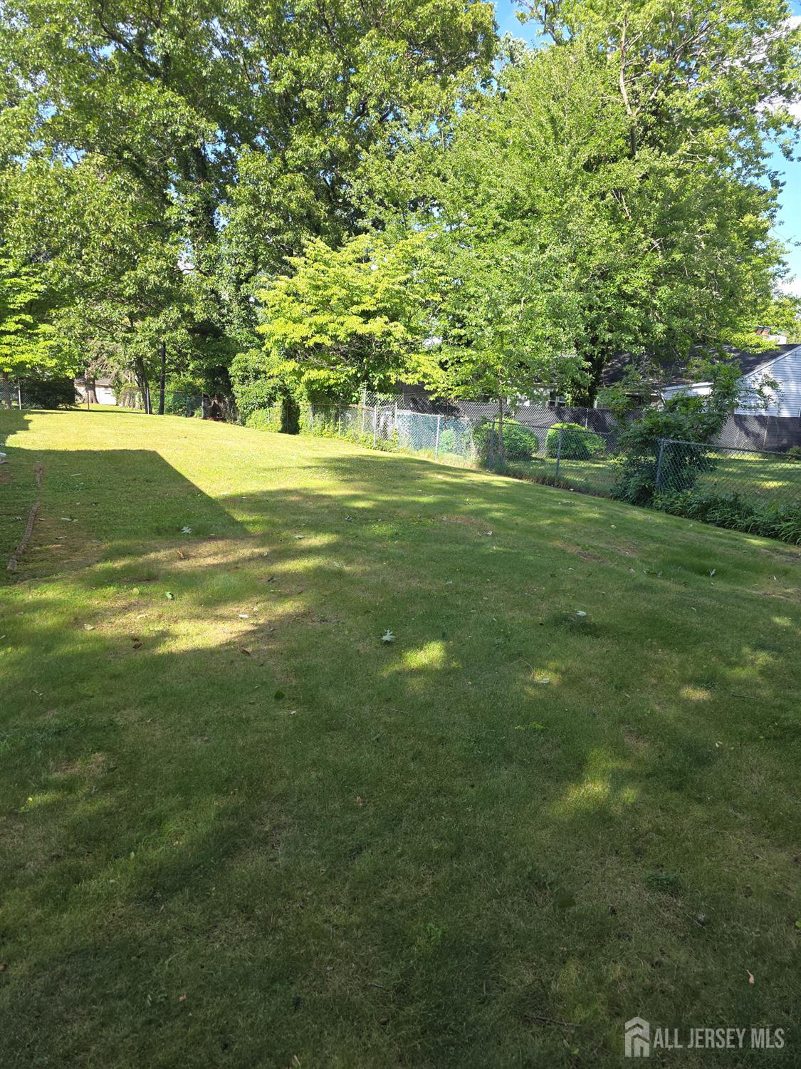 7 White Beech Court Ewing, NJ 08618 - Photo 3 of 4 a view of yard with swimming pool and green space