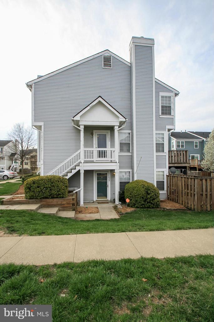 11029 Sentry Ridge Road, Unit 11 Manassas, VA 20109 - Photo 2 of 30 a front view of a house with a yard