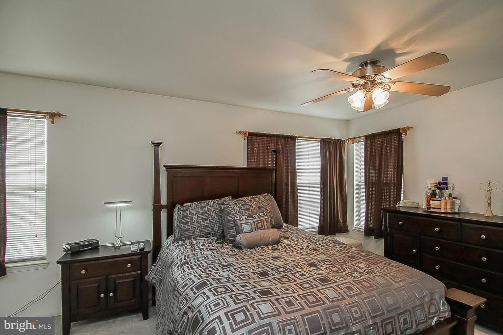 11029 Sentry Ridge Road, Unit 11 Manassas, VA 20109 - Photo 16 of 30 a bedroom with a bed and a closet