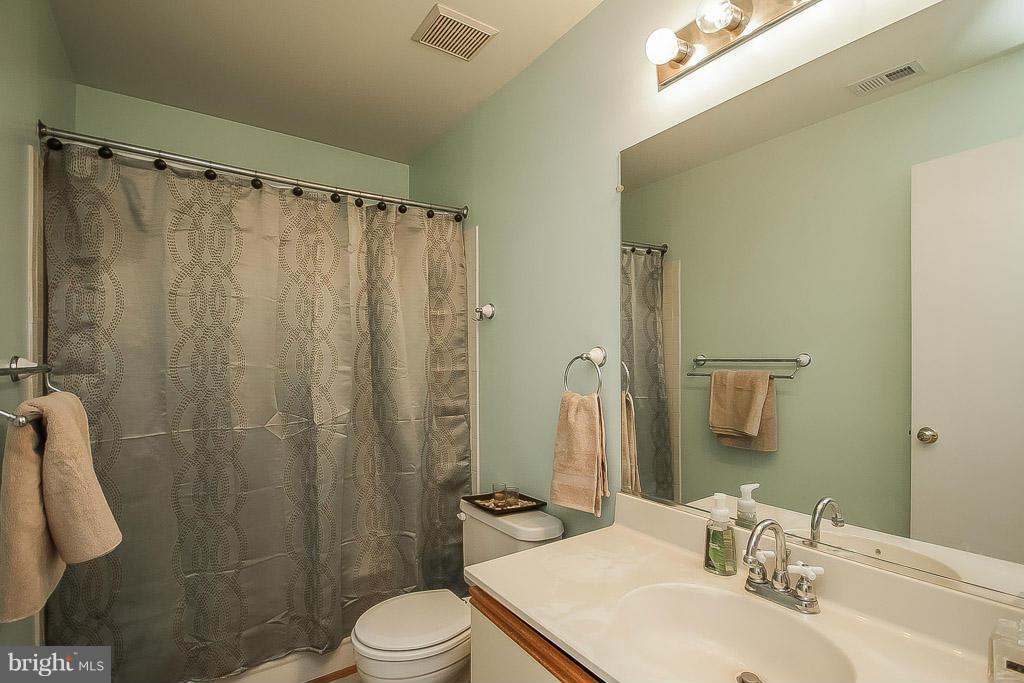 11029 Sentry Ridge Road, Unit 11 Manassas, VA 20109 - Photo 18 of 30 a bathroom with a sink toilet and shower