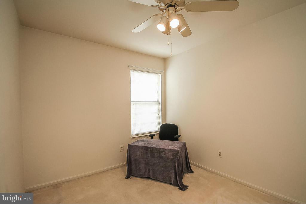 11029 Sentry Ridge Road, Unit 11 Manassas, VA 20109 - Photo 20 of 30 a living room with furniture and a window