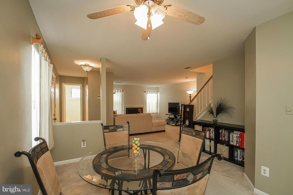 11029 Sentry Ridge Road, Unit 11 Manassas, VA 20109 - Photo 9 of 30 a very nice looking dining room with a table and chairs
