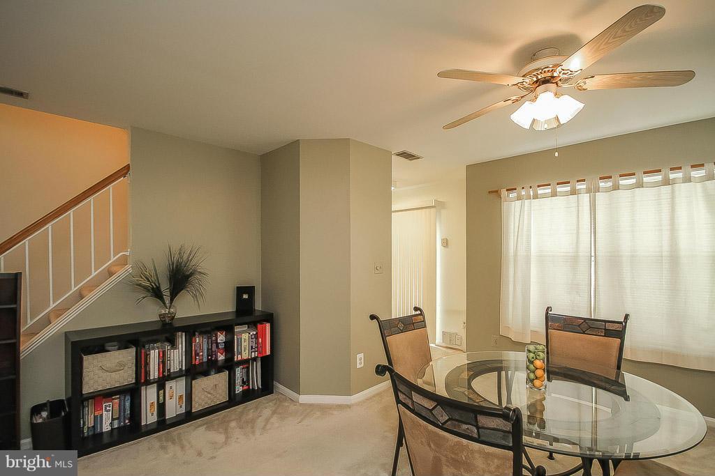 11029 Sentry Ridge Road, Unit 11 Manassas, VA 20109 - Photo 10 of 30 a living room with furniture and decor