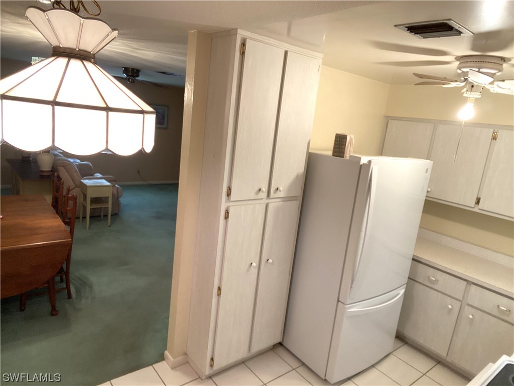 347 Richland Road Lehigh Acres, FL 33936 - Photo 11 of 26 a view of kitchen with furniture and window