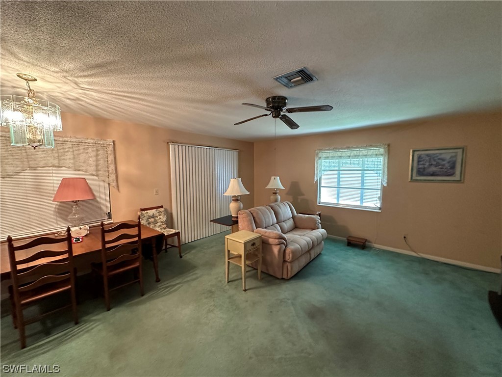 347 Richland Road Lehigh Acres, FL 33936 - Photo 8 of 26 a living room with furniture and a window