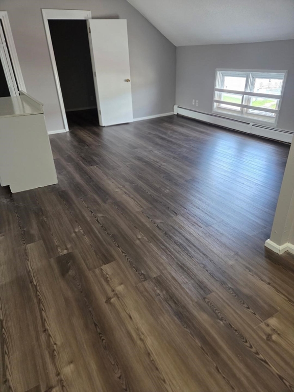 14 Carver Street, Unit 3 Fall River, MA 02721 - Photo 4 of 8 wooden floor in an empty room with a window