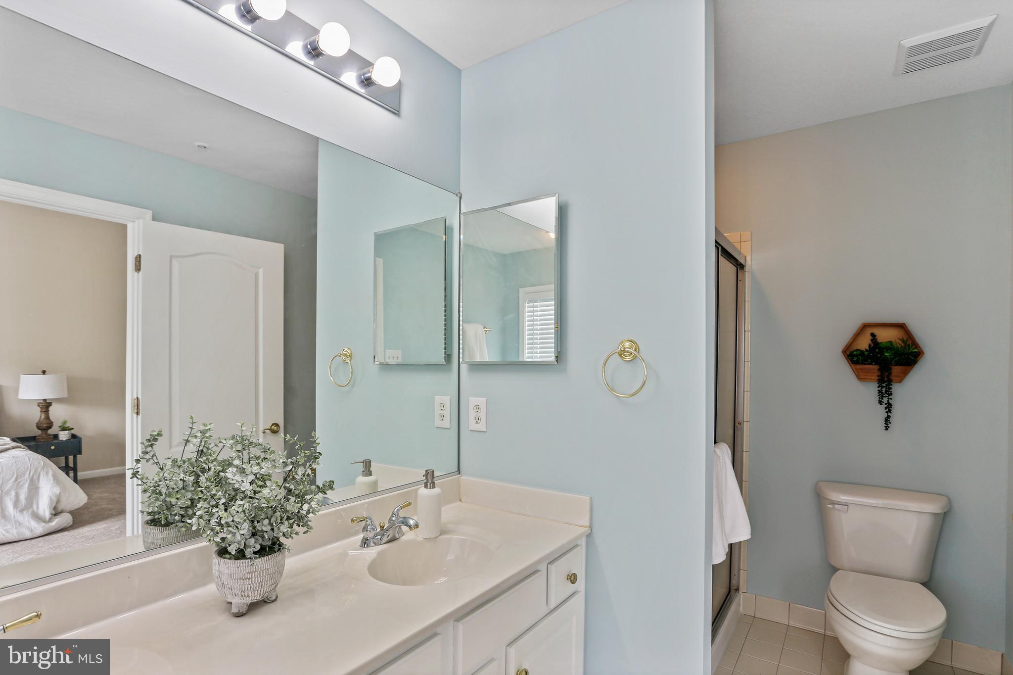 10232 Rutland Round Road, Unit 24 Columbia, MD 21044 - Photo 17 of 31 a bathroom with a sink vanity granite and toilet