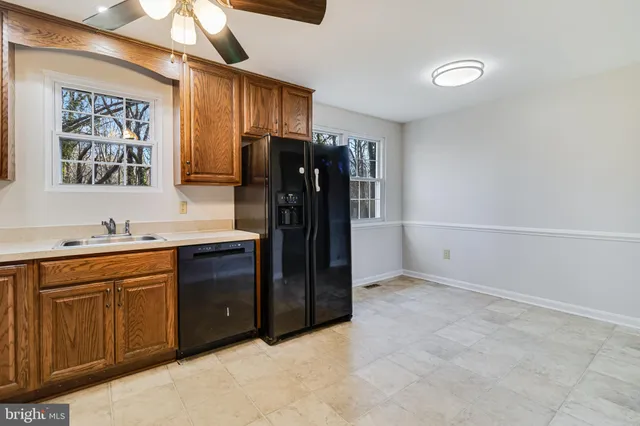 a kitchen with a refrigerator and a sink