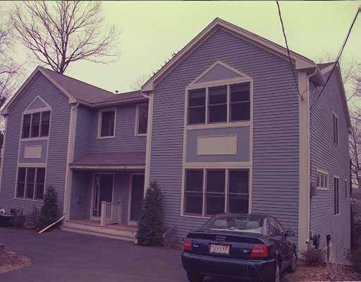 88 Ripley Street, Unit 88 Newton, MA 02459 - Photo 1 of 1 a front view of a house with a yard