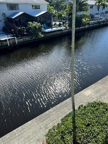 a view of balcony with wooden floor and outdoor seating