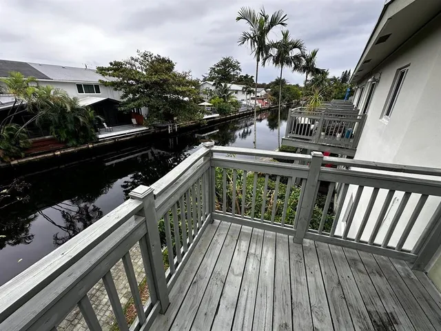 a balcony with wooden floor