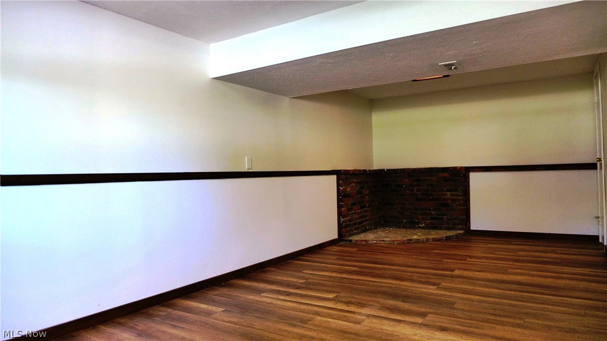 1854 Red Bird Road Madison, OH 44057 - Photo 18 of 19 Opposite view of Lower Level Rec/Family Room. Brick pad could be a great place for a free standing gas or electric fireplace