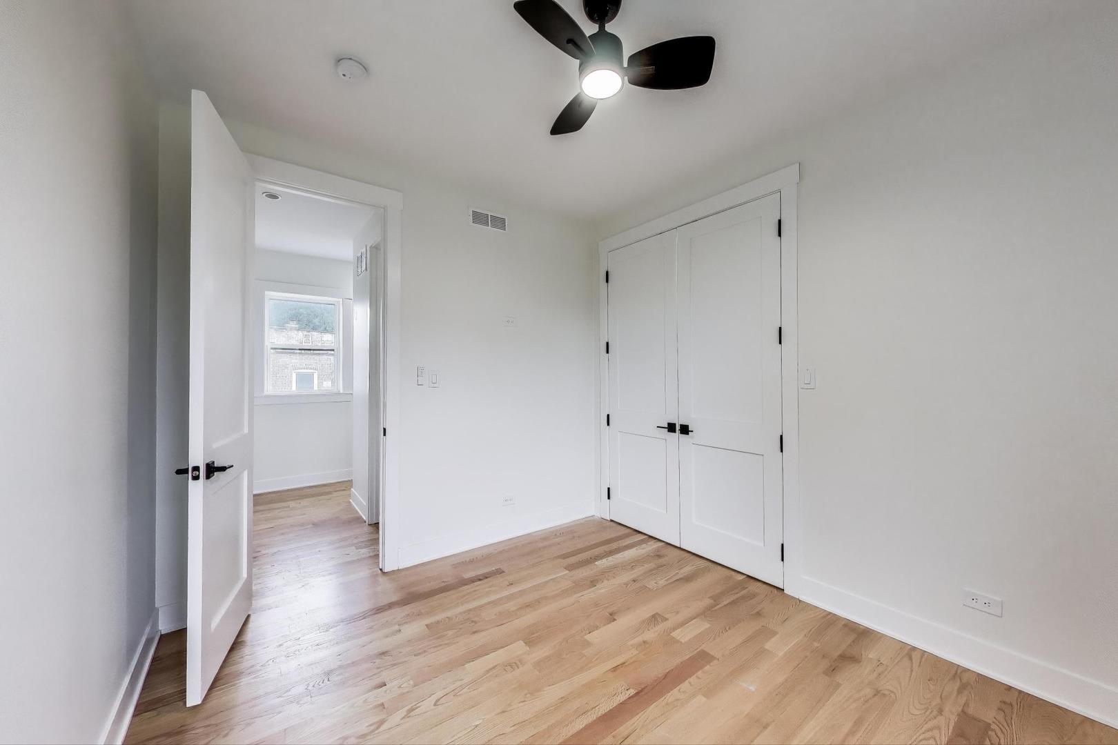6363 South Ellis Avenue, Unit 2 Chicago, IL 60637 - Photo 11 of 18 wooden floor in an empty room