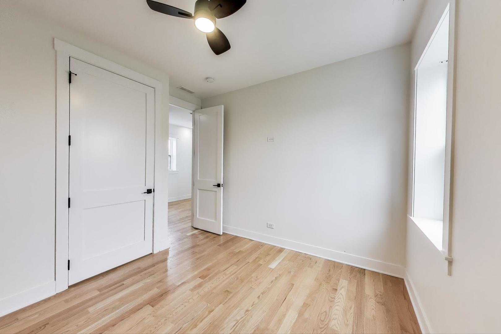 6363 South Ellis Avenue, Unit 2 Chicago, IL 60637 - Photo 13 of 18 a view of an empty room with wooden floor