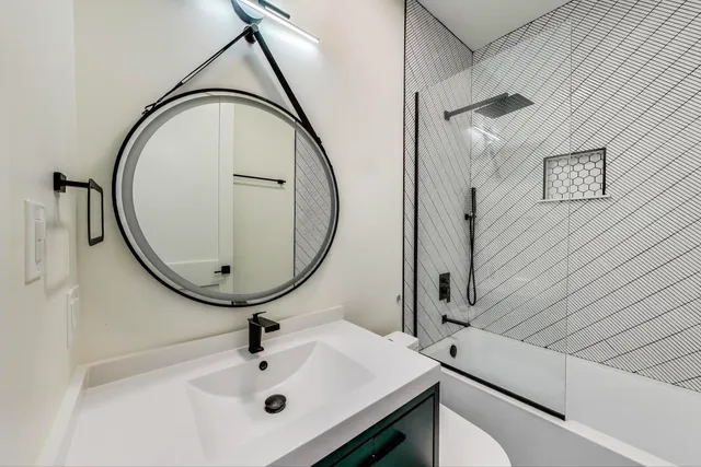 a bathroom with a sink and mirror