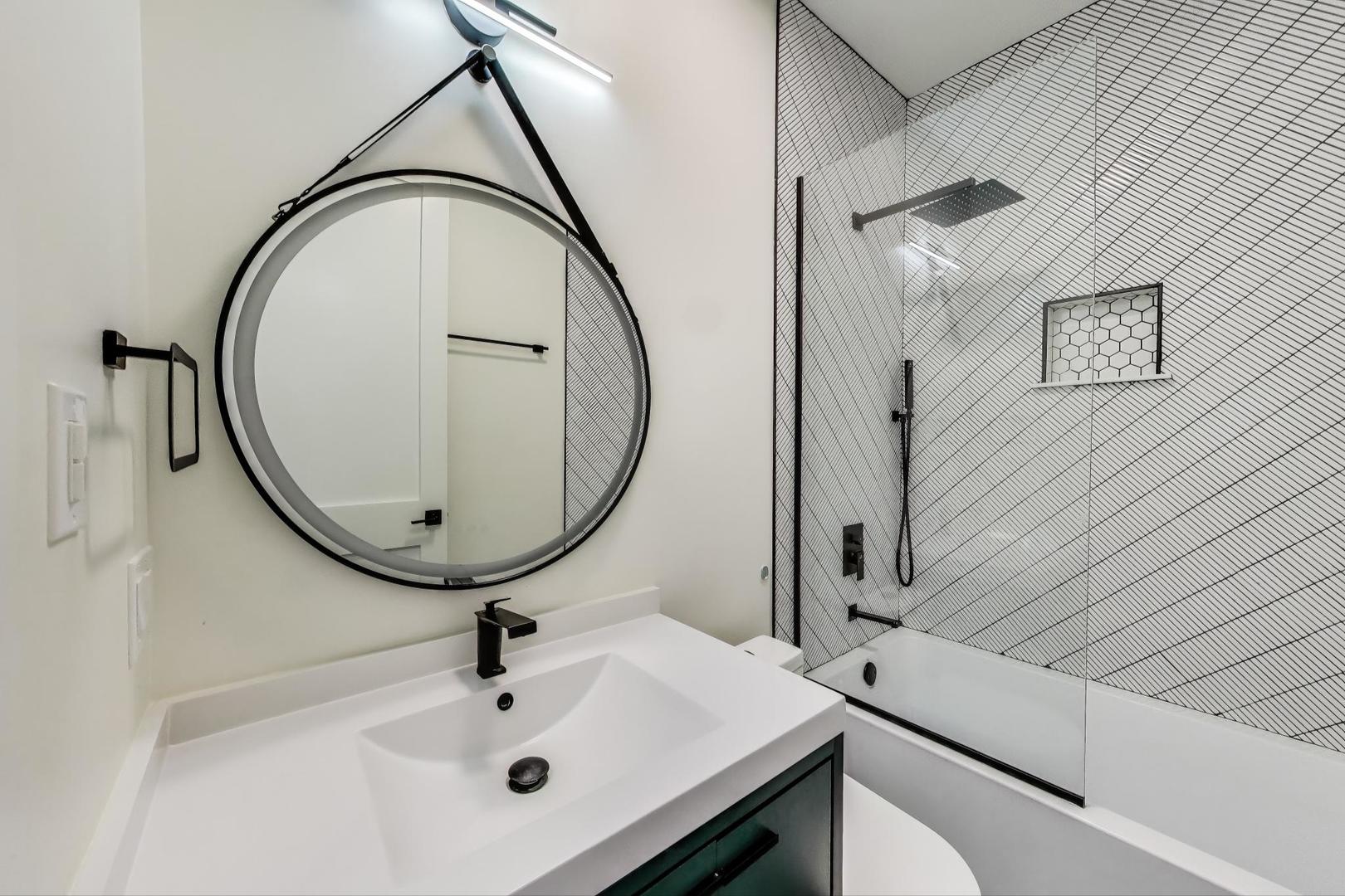 6363 South Ellis Avenue, Unit 2 Chicago, IL 60637 - Photo 14 of 18 a bathroom with a sink and mirror