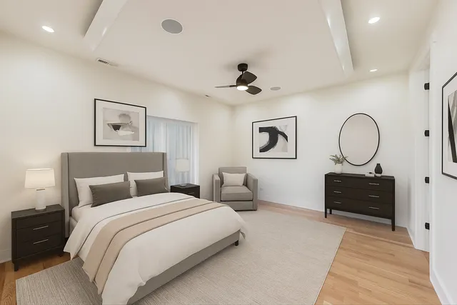 a bedroom with double bed and a dresser