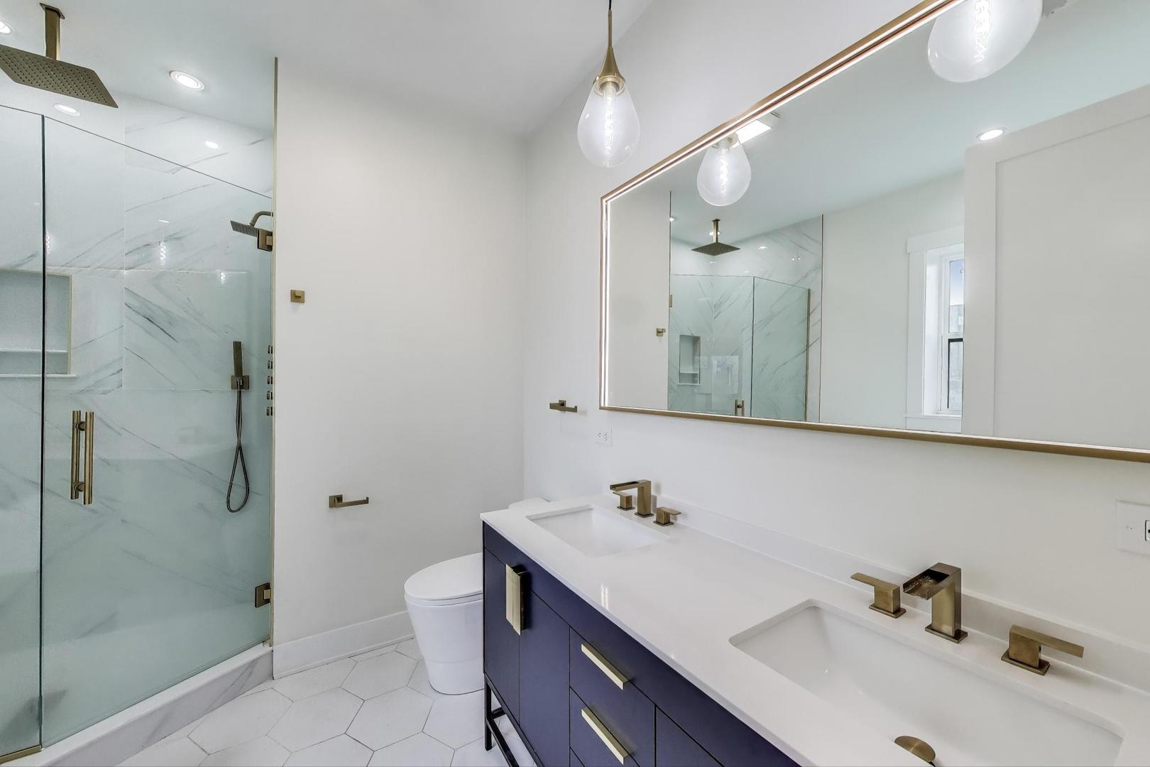 6363 South Ellis Avenue, Unit 2 Chicago, IL 60637 - Photo 8 of 18 a bathroom with a sink and mirror