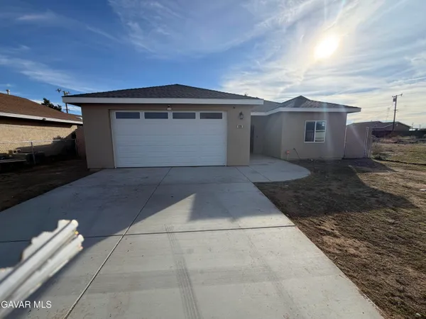 a view of backyard of house