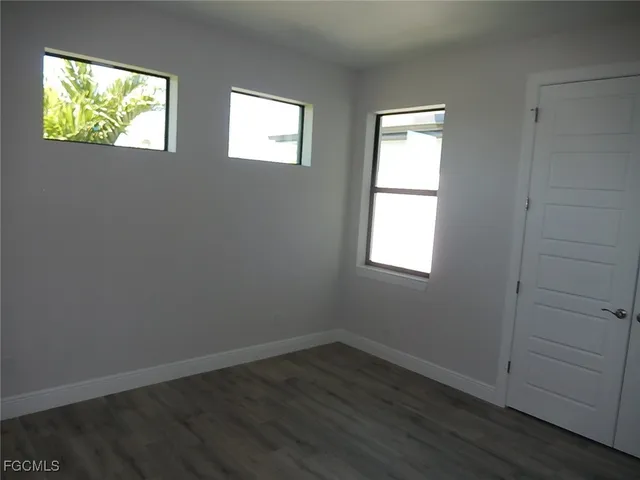 an empty room that has a window