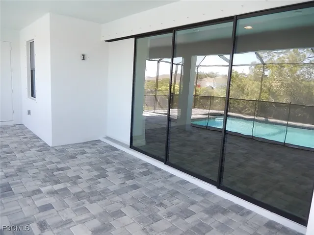 a view of empty room with sliding glass door