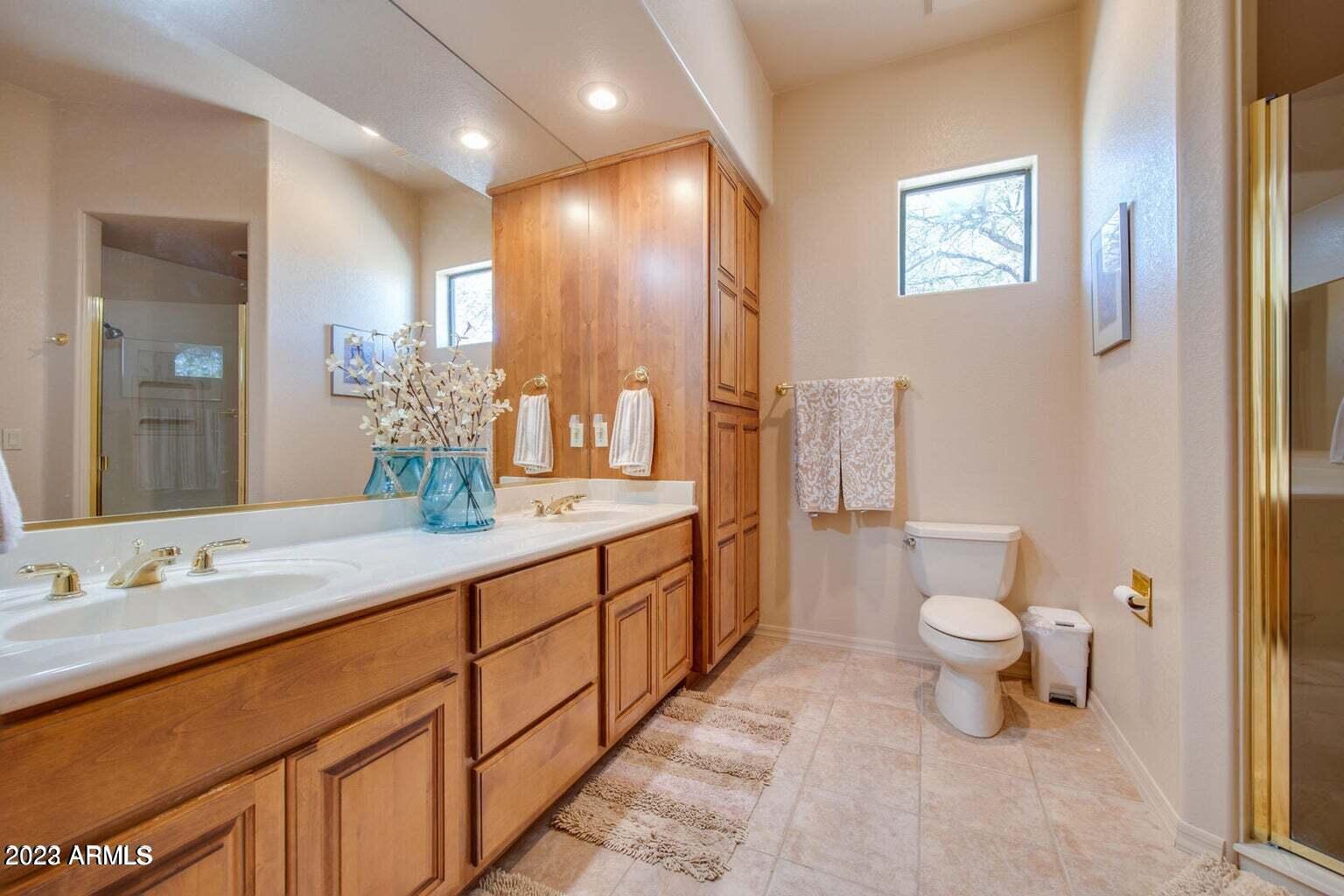 25603 North Sago Drive Rio Verde, AZ 85263 - Photo 8 of 25 a bathroom with a double vanity sink toilet and a mirror