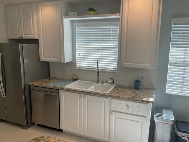 a bathroom with a sink and a window
