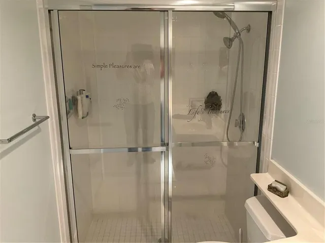 a bedroom with a bed and a mirror