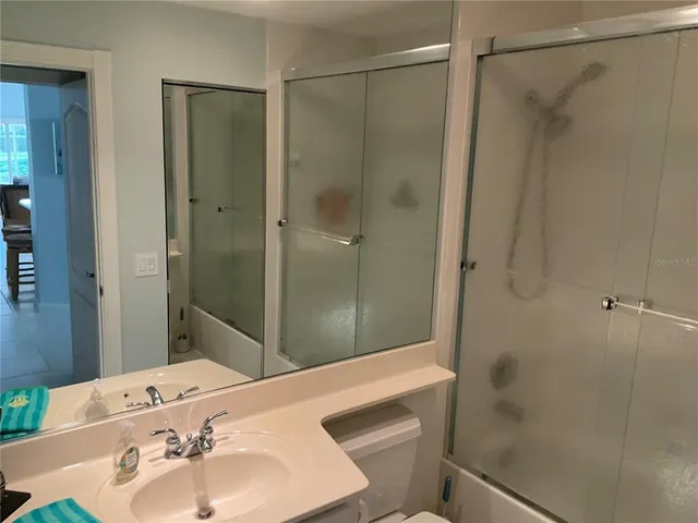 an aerial view of a house with outdoor space and lake view