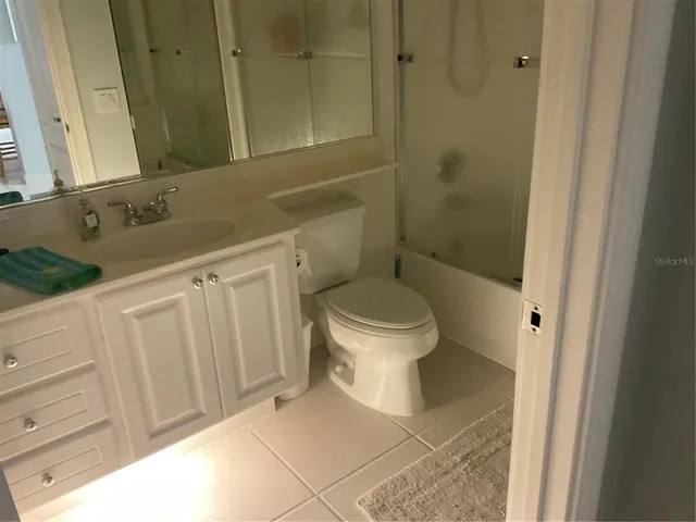 an aerial view of a house with outdoor space and swimming pool