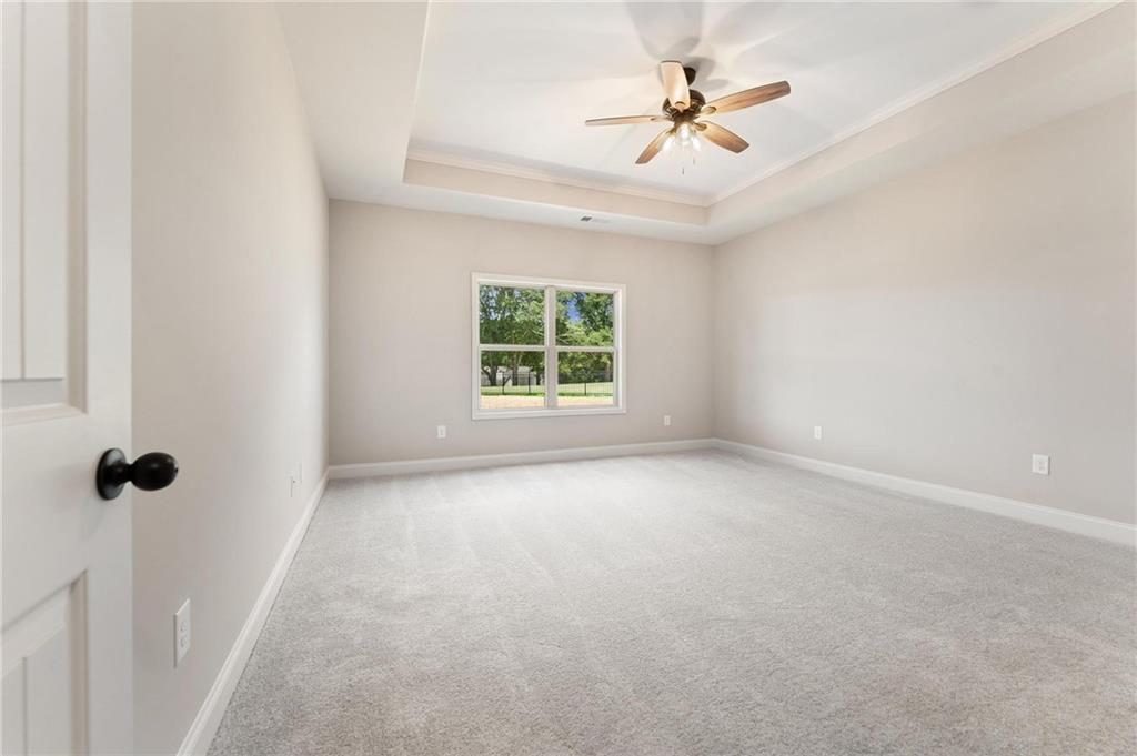 280 Camden Loop Jefferson, GA 30549 - Photo 17 of 43 wooden floor in an empty room with a window