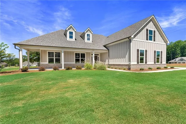 a front view of a house with a yard