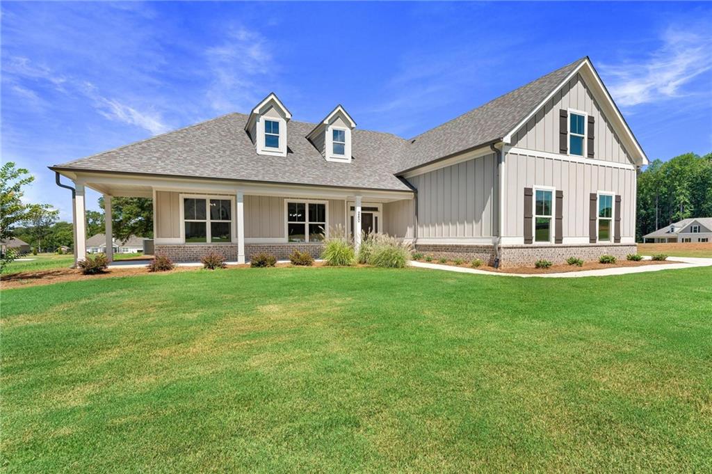 280 Camden Loop Jefferson, GA 30549 - Photo 2 of 43 a front view of a house with a yard