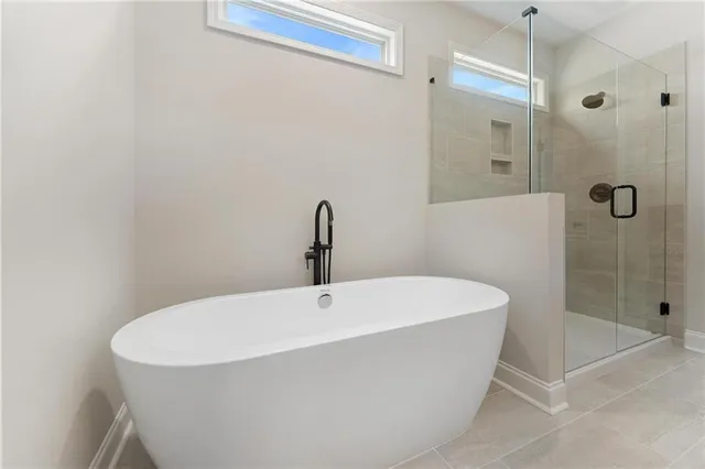 a bathroom with 2 sink and a mirror