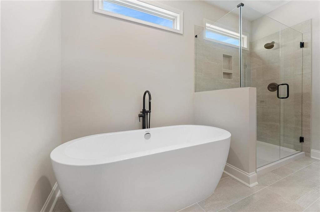 280 Camden Loop Jefferson, GA 30549 - Photo 21 of 43 a white bath tub sitting next to a shower