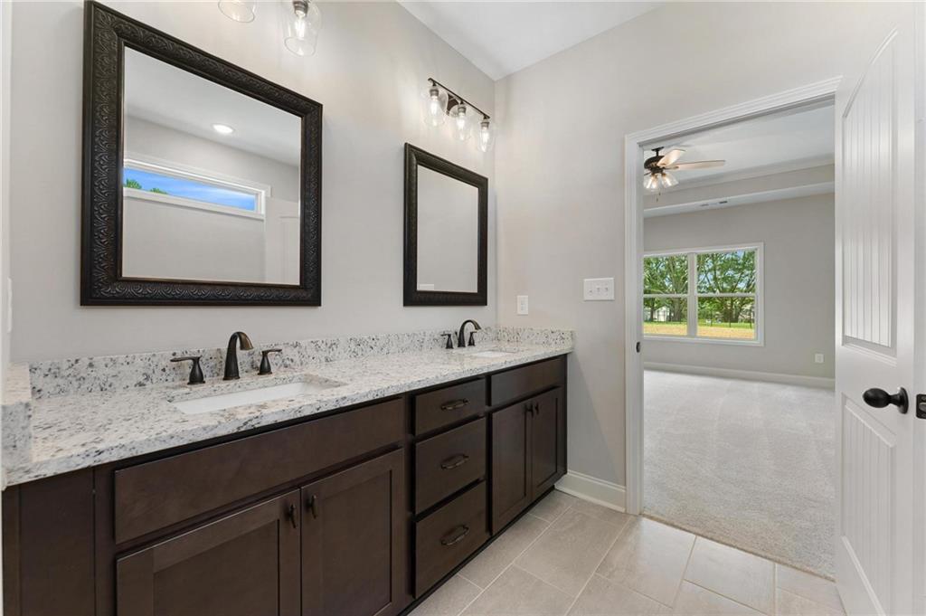 280 Camden Loop Jefferson, GA 30549 - Photo 22 of 43 a bathroom with 2 sink and a mirror