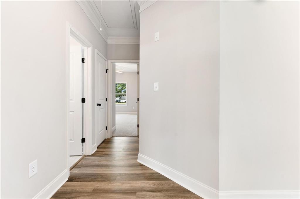 280 Camden Loop Jefferson, GA 30549 - Photo 25 of 43 a view of a hallway with wooden floor and closet