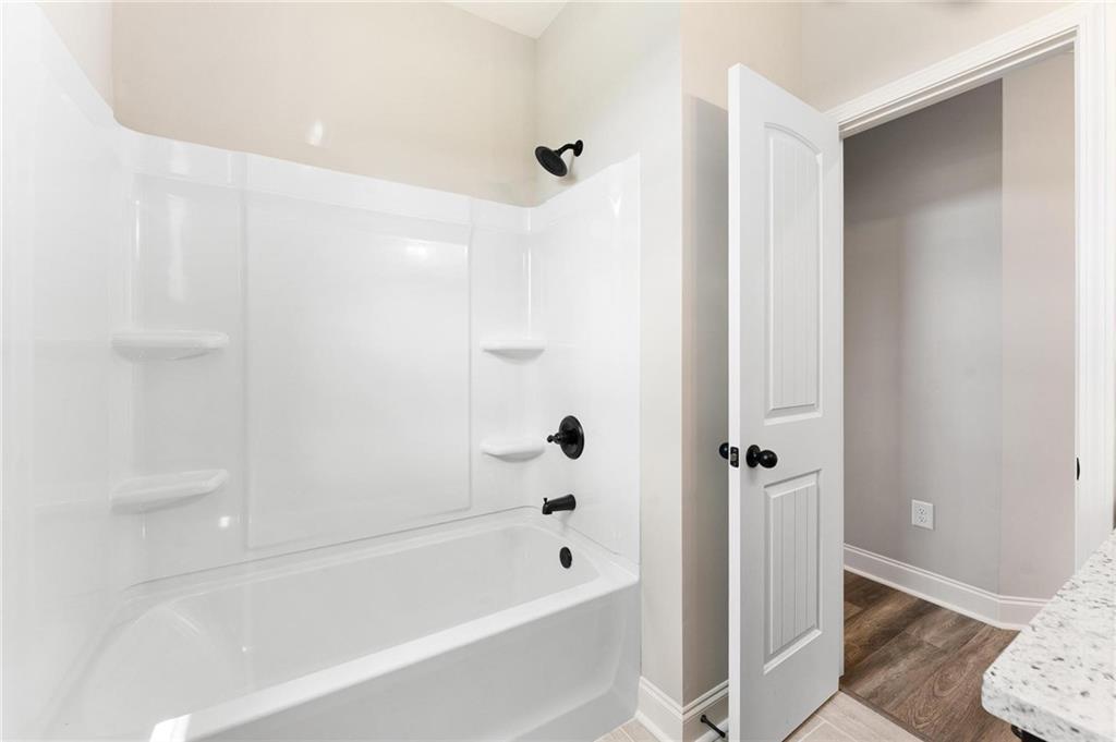 280 Camden Loop Jefferson, GA 30549 - Photo 27 of 43 a bathroom with a bathtub and a shower